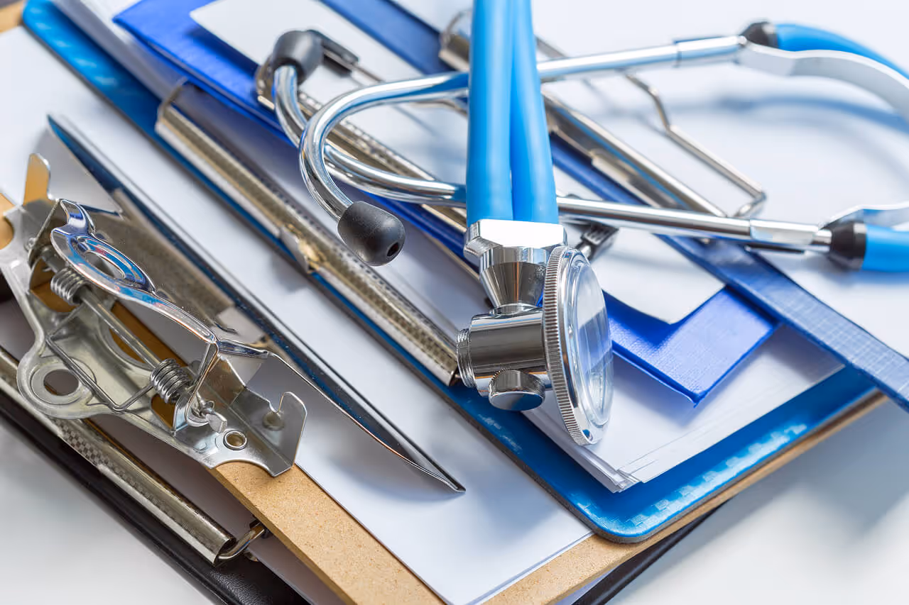 Stethoscope on medical clipboards with patient forms